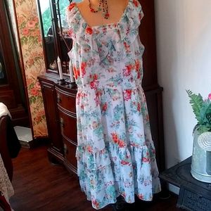 Sleeveless white dress with shades of blue.